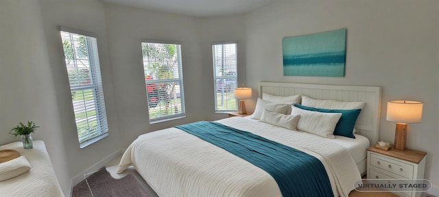 bedroom featuring baseboards