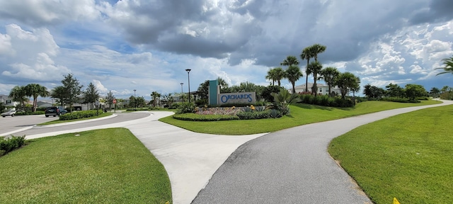 view of home's community featuring a lawn