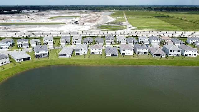 aerial view featuring a residential view and a water view