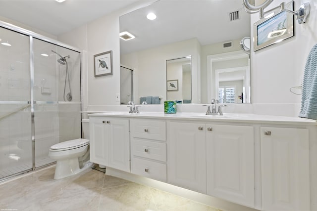 bathroom with walk in shower, vanity, and toilet