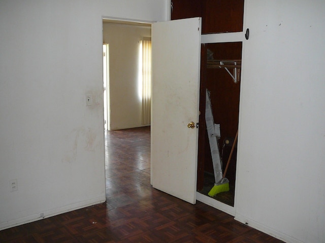 corridor featuring dark parquet floors