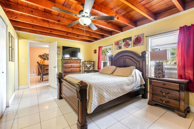 bedroom featuring multiple windows, light tile patterned floors, wood ceiling, and beamed ceiling