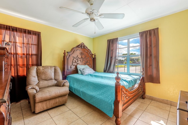 tiled bedroom with crown molding and ceiling fan