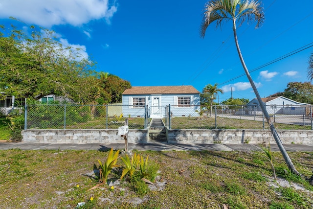 back of house with a lawn