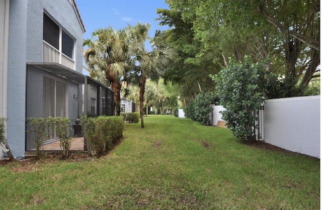 view of yard with a lanai