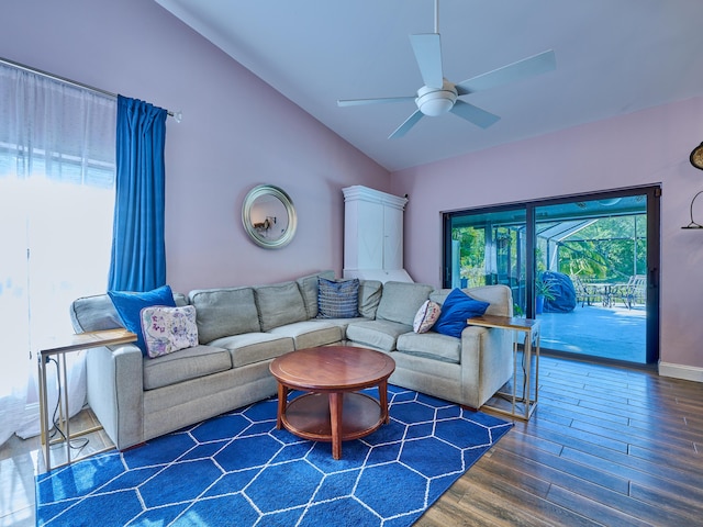 living room with lofted ceiling, dark wood-type flooring, and ceiling fan