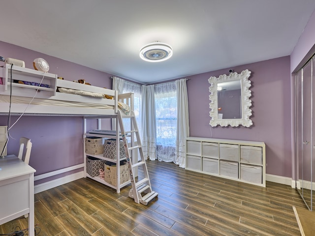 bedroom featuring dark wood-type flooring