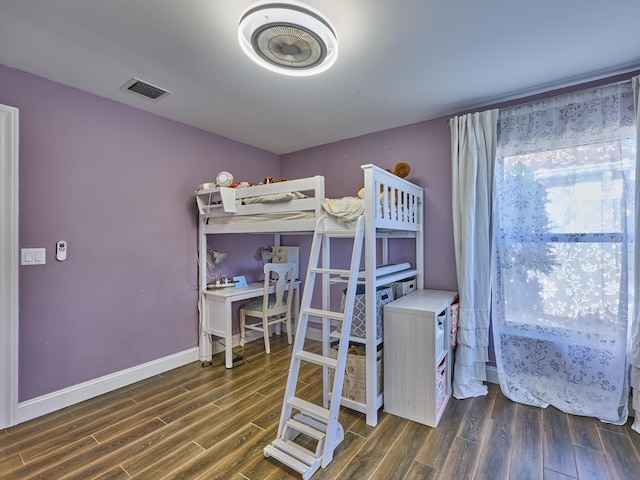 bedroom featuring dark wood-type flooring