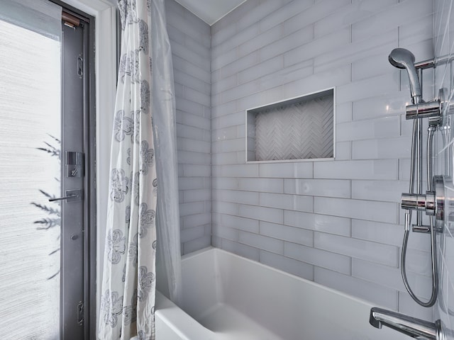 bathroom featuring shower / bath combination with curtain