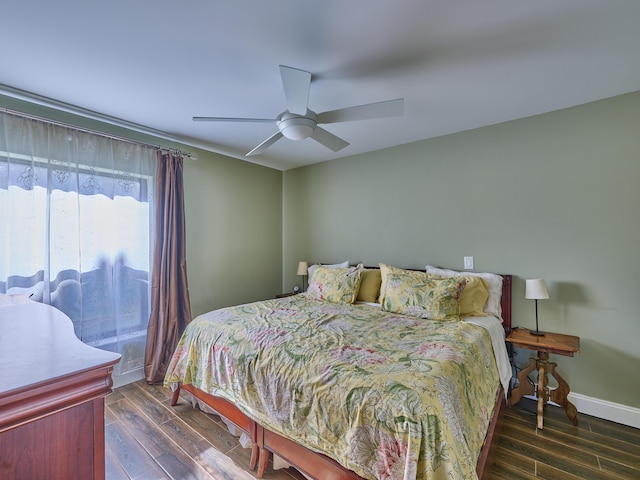 bedroom featuring ceiling fan and dark hardwood / wood-style flooring