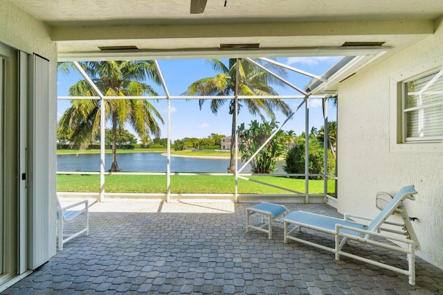 unfurnished sunroom with a water view and plenty of natural light