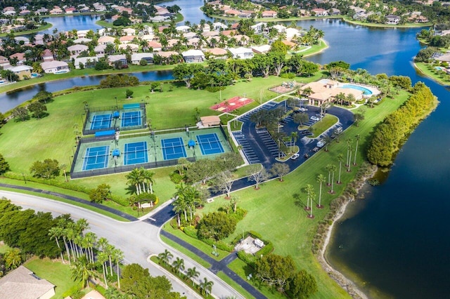 drone / aerial view featuring a water view and a residential view