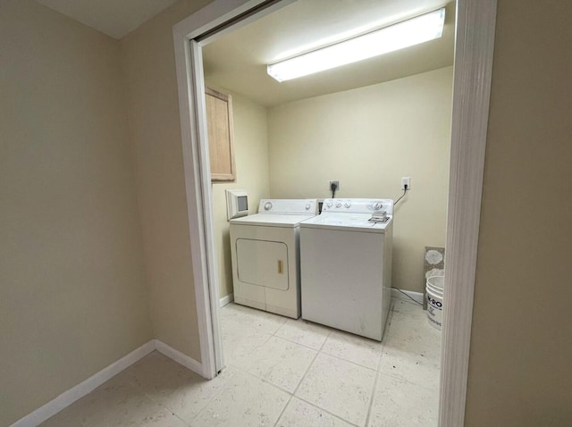 clothes washing area with washing machine and clothes dryer