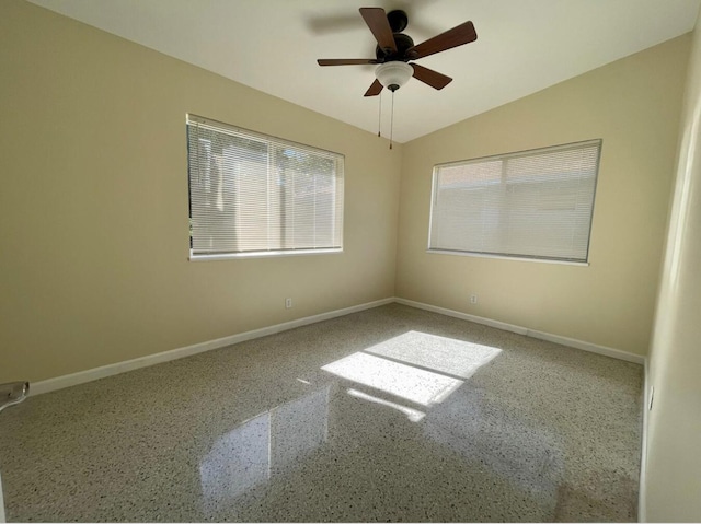 unfurnished room featuring ceiling fan and lofted ceiling