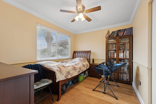 bedroom with light hardwood / wood-style flooring, ornamental molding, and ceiling fan