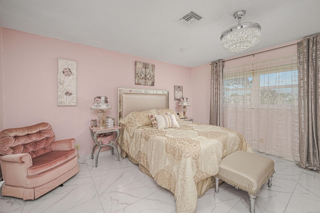 bedroom featuring a textured ceiling