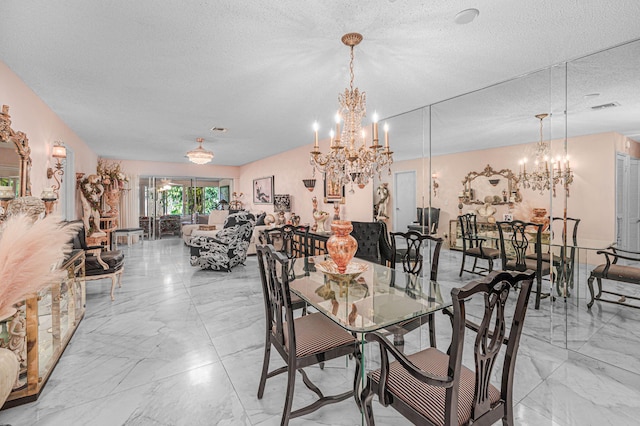 dining room with an inviting chandelier and a textured ceiling