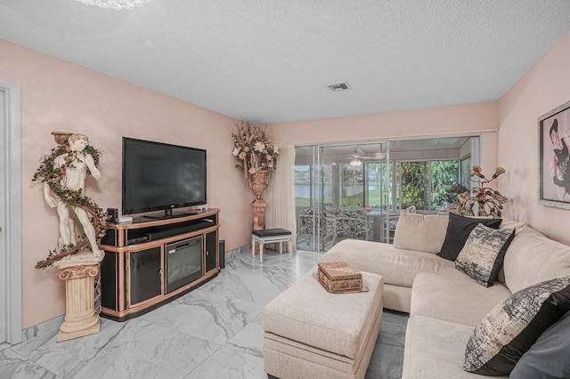 living room featuring a textured ceiling