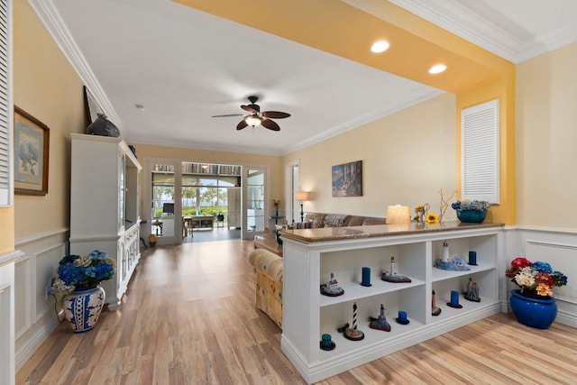 kitchen featuring light hardwood / wood-style flooring, ornamental molding, and ceiling fan