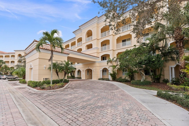 view of property with decorative driveway
