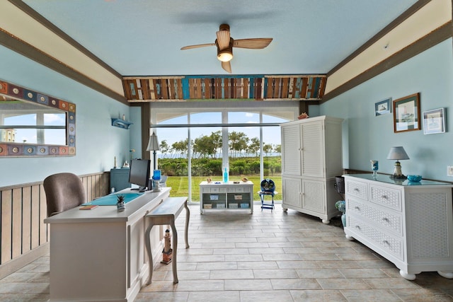 interior space with ceiling fan