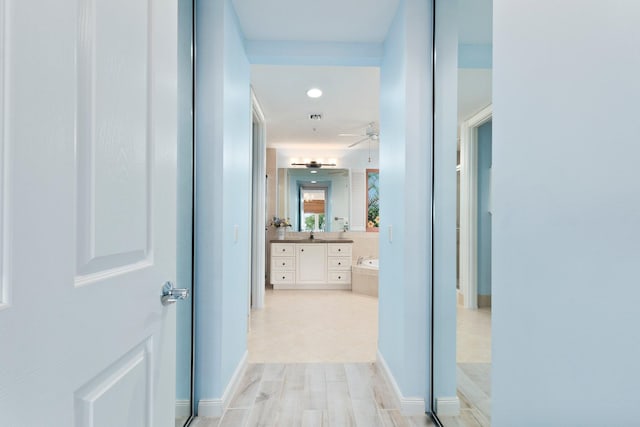 hallway featuring sink