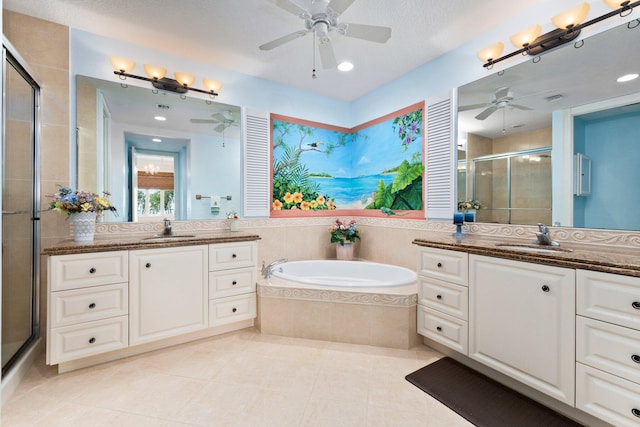 bathroom featuring tile patterned flooring, vanity, shower with separate bathtub, and ceiling fan