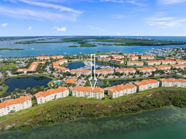 birds eye view of property with a water view