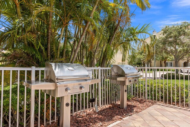 view of patio / terrace featuring french doors, a grill, exterior kitchen, and sink