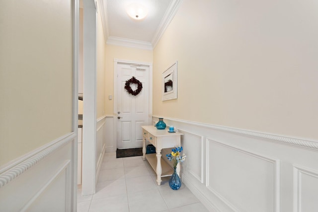 entryway featuring light tile patterned floors and crown molding