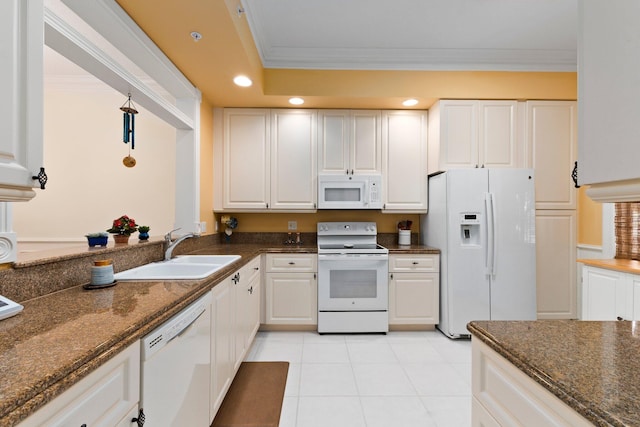 kitchen featuring ornamental molding, white appliances, white cabinets, and a sink