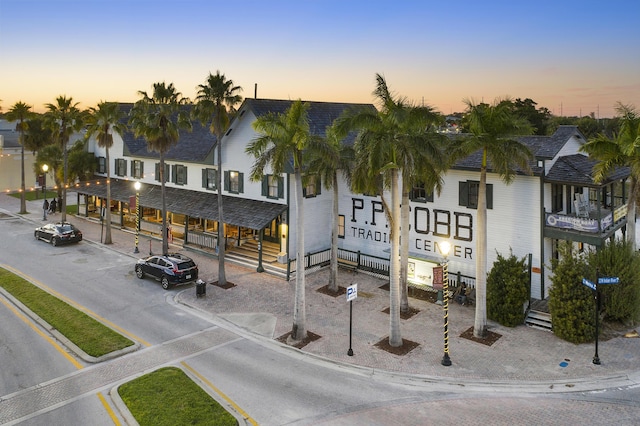 view of outdoor building at dusk