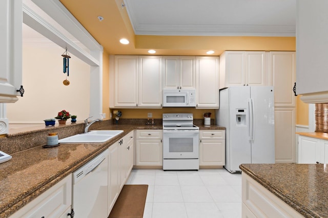 kitchen with white cabinetry, white appliances, dark stone counters, and sink