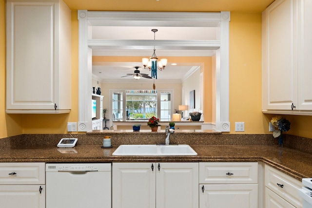 kitchen featuring pendant lighting, sink, white dishwasher, ornamental molding, and white cabinets