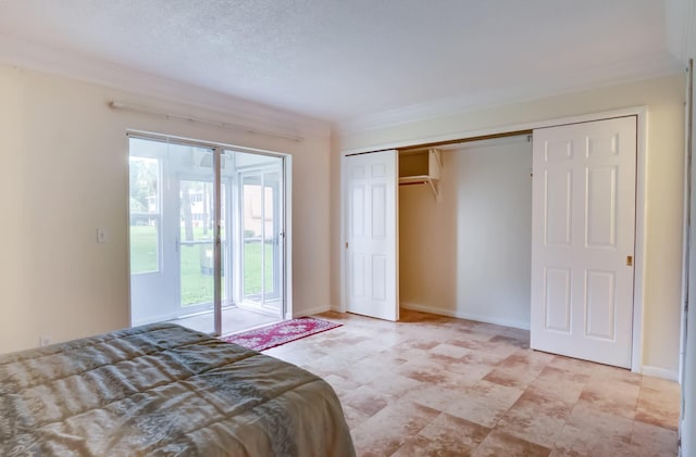 unfurnished bedroom featuring crown molding, access to exterior, a closet, and a textured ceiling