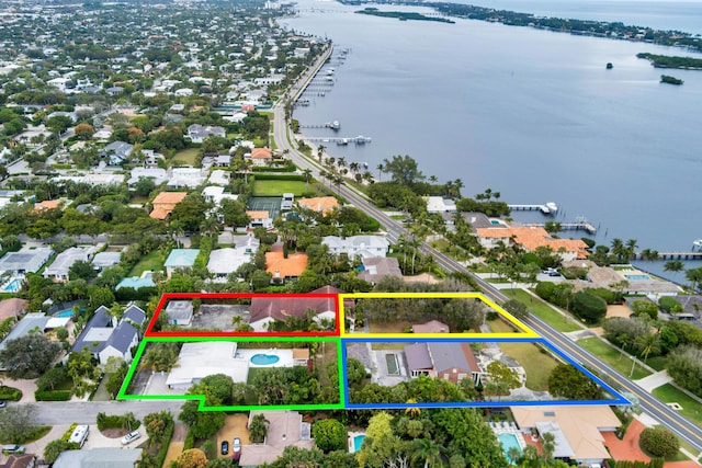 birds eye view of property featuring a water view and a residential view