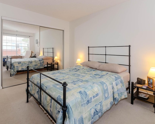 carpeted bedroom with a closet