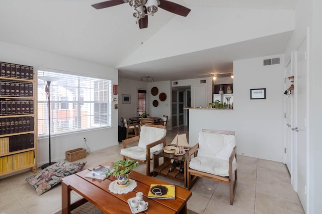 living room featuring light tile patterned floors and vaulted ceiling