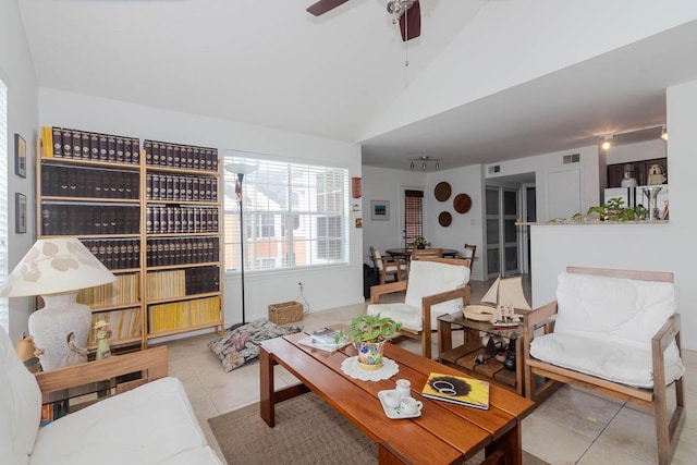 tiled living room with vaulted ceiling and ceiling fan