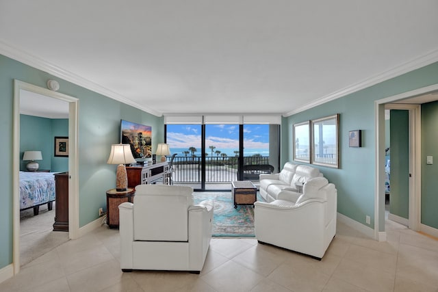 living room featuring expansive windows, ornamental molding, and light tile patterned flooring