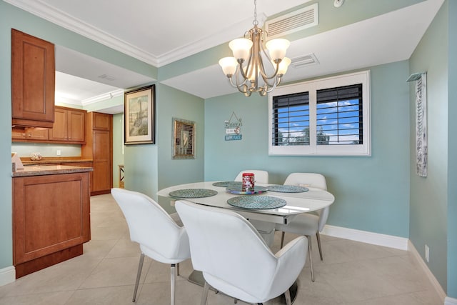 dining room with crown molding, light tile patterned flooring, and a notable chandelier