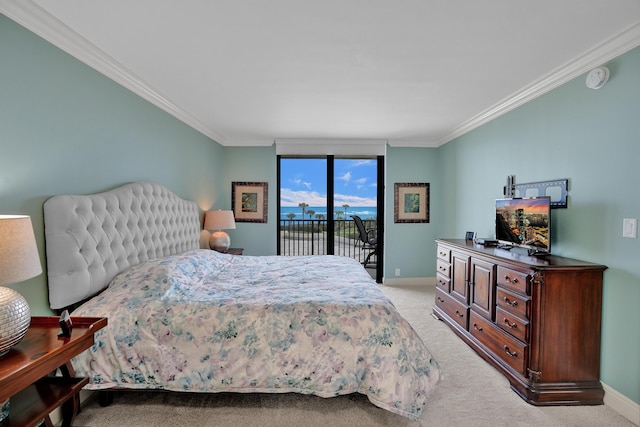 carpeted bedroom with crown molding and access to exterior