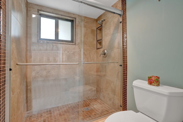 bathroom with walk in shower and toilet