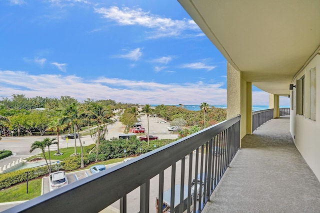 balcony featuring a water view