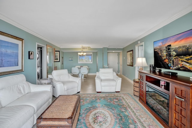 living room featuring an inviting chandelier and ornamental molding