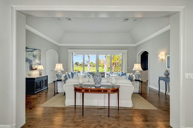 living room with crown molding, dark hardwood / wood-style floors, and vaulted ceiling