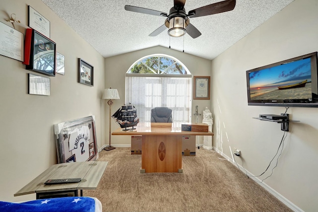 office with ceiling fan, light colored carpet, vaulted ceiling, and a textured ceiling