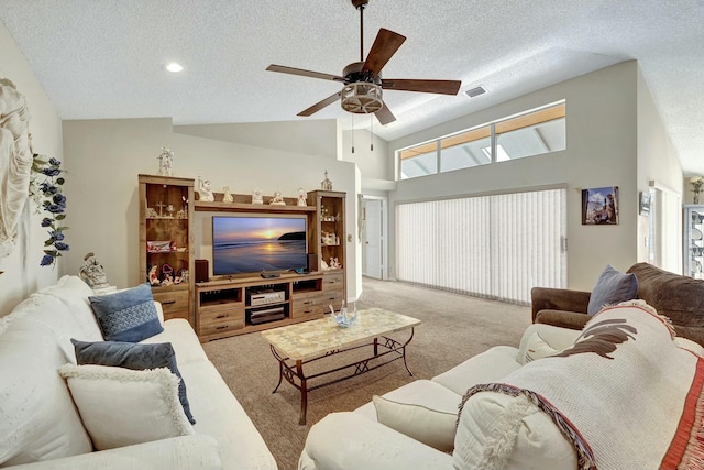 living room featuring ceiling fan, high vaulted ceiling, light colored carpet, and a textured ceiling