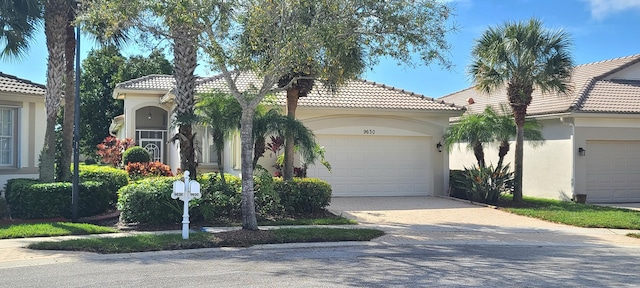 mediterranean / spanish-style home featuring a garage