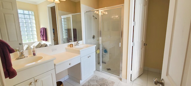 bathroom featuring tile patterned flooring, vanity, ornamental molding, and walk in shower